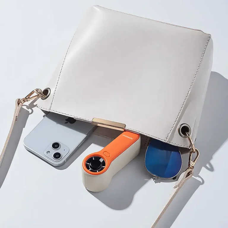 پنکه دستی سایز جیبی پورودو لایفاستایل Porodo Lifestyle Pocket Size Handheld Fan قابل حمل و قرار گرفتن در کیف در رنگ نارنجی سفید